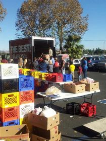 Barona Resort & Casino staff members unload a truck filled with food collected for East County families.