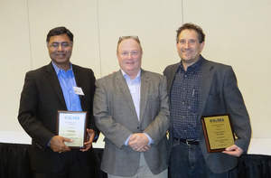 Todd O'Grady,center, president of the Great Lakes Renewable Energy Association, presented the Exemplary Project for 2014 for 1-800-LAW-FIRM to Prasad Gullapalli of Srinergy, at left, and Andy Levin, Lean & Green Michigan.