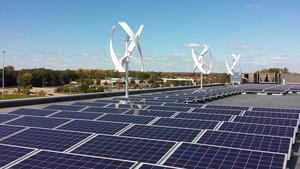 Roof-mounted solar panels and wind turbines at 1-800-LAW-FIRM building in Southfield, Michigan.
