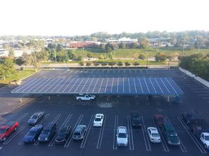 The 80.64 kW solar carport at 1-800-LAW-FIRM is part of the renewable energy savings project installed by Srinergy.