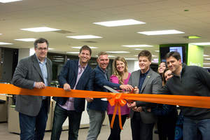 Hireology CEO Adam Robinson leads the ribbon cutting, officially opening new headquarters.