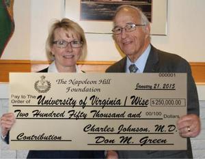 Don Green, the Foundation's director, presented a $250,000 check to Chancellor Donna P. Henry.