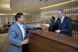 Full circle check in: General Manager Walter Andrews welcomes guests to the new Newport Marriott on April 10. When the hotel first opened in 1988, Andrews worked as the Front Office Manager. 
