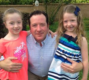 Matt Ray with twin daughters, Madeline and Leslie.