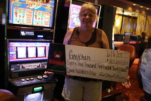 Gretchen, from Elverta, Calif., celebrates an $83,237 slot jackpot at Red Hawk Casino.