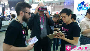 iStaging staff showing their augmented reality app to a visitor