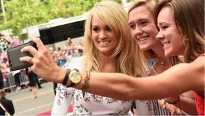 Pictured: Carrie Underwood takes a selfie with fans on 2015 CMT Music Awards Red Carpet on June 10, 2015. Photo courtesy of High Five Entertainment