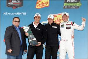 DEKRA congratulates the Green Challenge Winning Team #911 Porsche North America Porsche 911 RS. Pictured (left to right) are Donald O. Nicholson, CEO and President of DEKRA North America, Team Manager Morgan Brady, and Drivers Patrick Pilet and Nick Tandy.