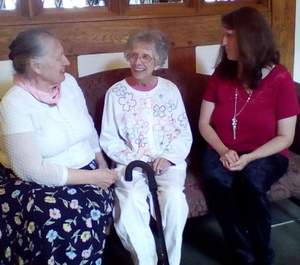 Irene Scollard, center, shares a funny story with SCS home health aides, Sandy Peace, at left, and Ann Woodby.