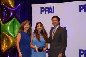 PPAI's Tina Filipski, left, and Paul Bellantone, right, present Sasha Pirrie as a 2015 PPB Rising Star.