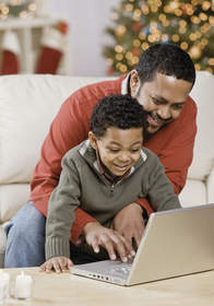 Father and son looking at a laptop