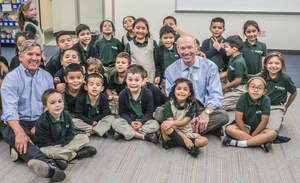 Chris Romer and Robert Hottman (L-R) with students from STRIVE Prep - Ruby Hill Elementary School in Denver.
