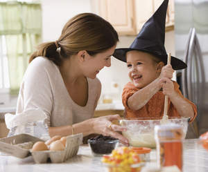 Mother and child baking for Halloween