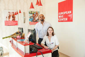EWC Michigan Regional Developer Shehzad Khan and receptionist Leigh Young welcome visitors to the Canton store.