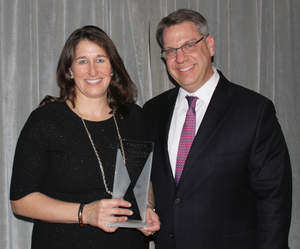 BCG's Wendy Woods with CEO Rich Lesser after receiving a Women Leaders in Consulting Award for leadership from Consulting magazine.