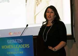 Wendy Woods, global head of BCG's Social Impact practice, accepts her Women Leaders in Consulting Award at a gala dinner in New York.