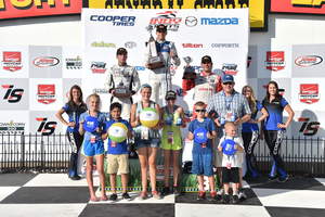 Members of Big Brothers Big Sisters of Central Iowa pose with IndyCar Series Iowa Corn 300 winners.