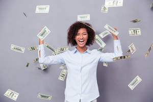 Smiling woman standing in floating money