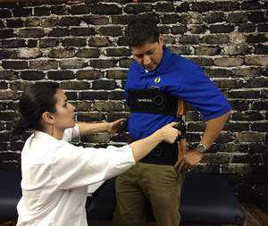 Spine Care Center Specialist Helping Patient Relieve Back Pain with a $299 VerteCore Lift