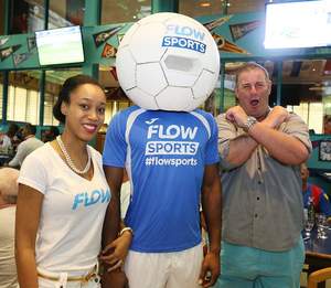 Flow hostess join football head mascot and Manchester United fan as they share lens time during the Flow hosted FA Cup Finals Viewing Party on May 21.