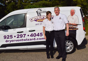 Veronica and Paul Cushing by their Dryer Vent Wizard van, photo courtesy of Dryer Vent Wizard