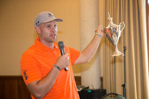 Former University of Florida quarterback and Gator Great, Danny Wuerffel holding the Desire Cup.  On Oct. 27-29, Wuerffel will celebrate his Heisman Trophy 20th anniversary in a "Rivalry for a Cause" at the 6th Annual Desire Cup fundraiser weekend at TPC Sawgrass during Florida-Georgia football game weekend.