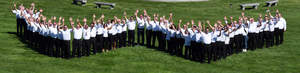 Dryer Vent Wizard franchisees give a "hands up" for the company's 10th anniversary celebration.