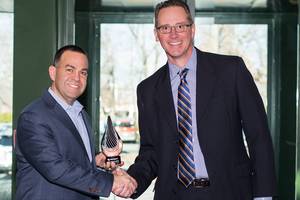 Darren Raiguel of ePlus (left) receives Opengear's 2017 award for Partner of the Year in North America.