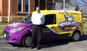 Chris Mader is pictured in front of his Dryer Vent Wizard van, by the original homestead of A.I. Root, one of the founding businesses in Medina, Ohio