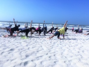 Free community yoga on the beach draws clients from all over the Tampa Bay area, including locals and tourists.