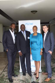 The Hon. Melford Nicholas (2nd left), Antigua and Barbuda's Minister of  Information, Broadcasting, Telecommunications and Information Technology shares lens time with Cable and Wireless Caribbean Executives during the CTU's ICT Week and Symposium in March. With the Minister (from l-r) are: Garry Sinclair, President, Cable and Wireless Caribbean; Wendy McDonald, Snr. Director Caribbean Communications and Joe Mathieson, Country Manager Flow Antigua & Barbuda.