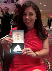 Jeanette Maister, managing director - Americas, accepts the Silver Stevie Award for Women in Business
